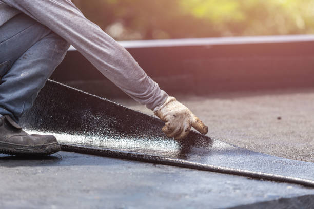 Professional Waterproofing technician working in Raymond, WA